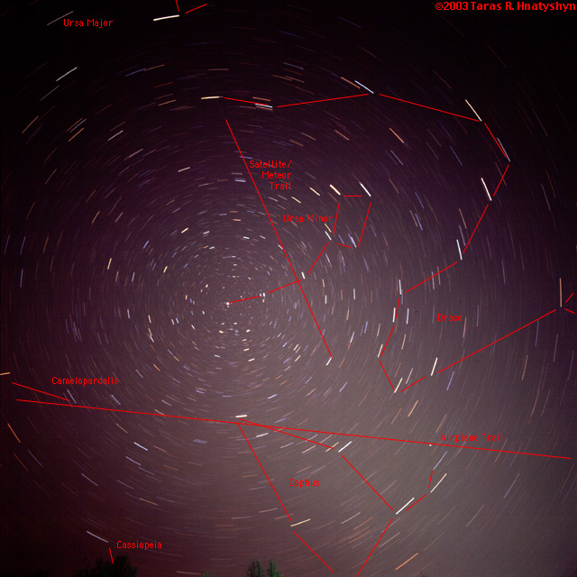 Polar star trails with plane and satellite.